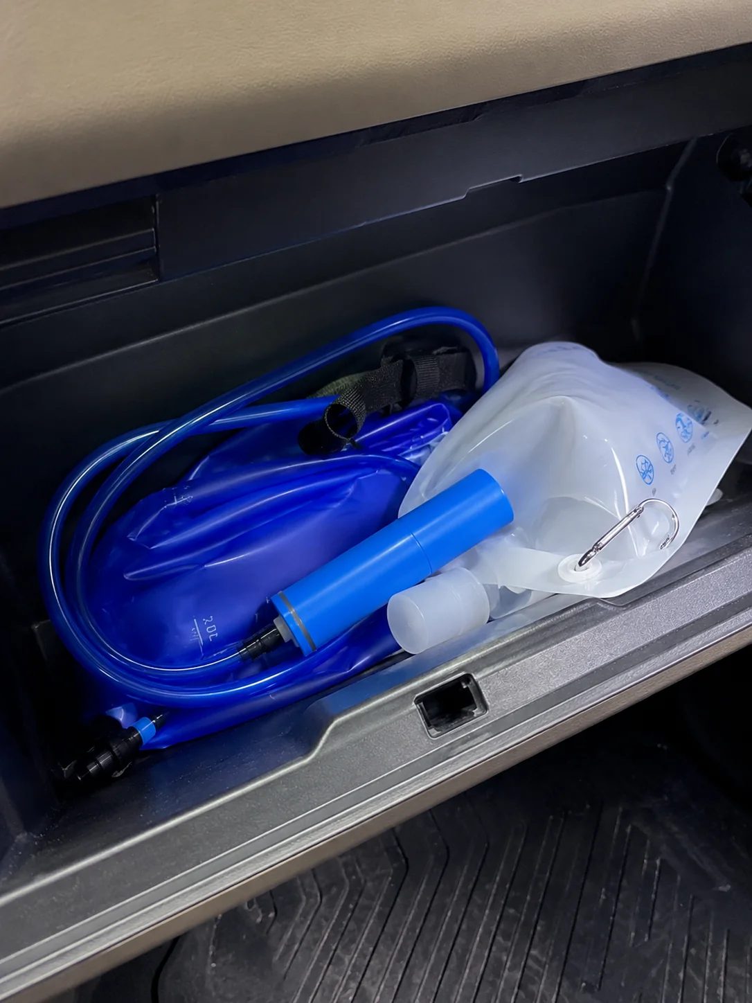 Gravity filter kit stored in a car glovebox