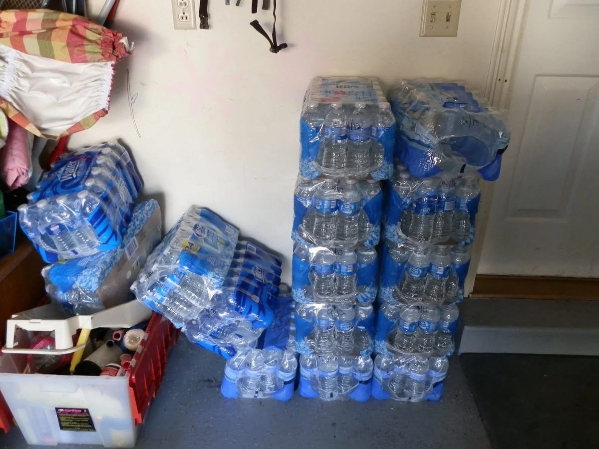 Cases of bottled water stacked in a garage